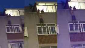 Dos personas sujetan a un hombre para evitar que caiga por la ventana en Cornellà / CG