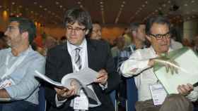 Francesc Sánchez, Carles Puigdemont y Artur Mas, en el congreso de refundación de CDC.