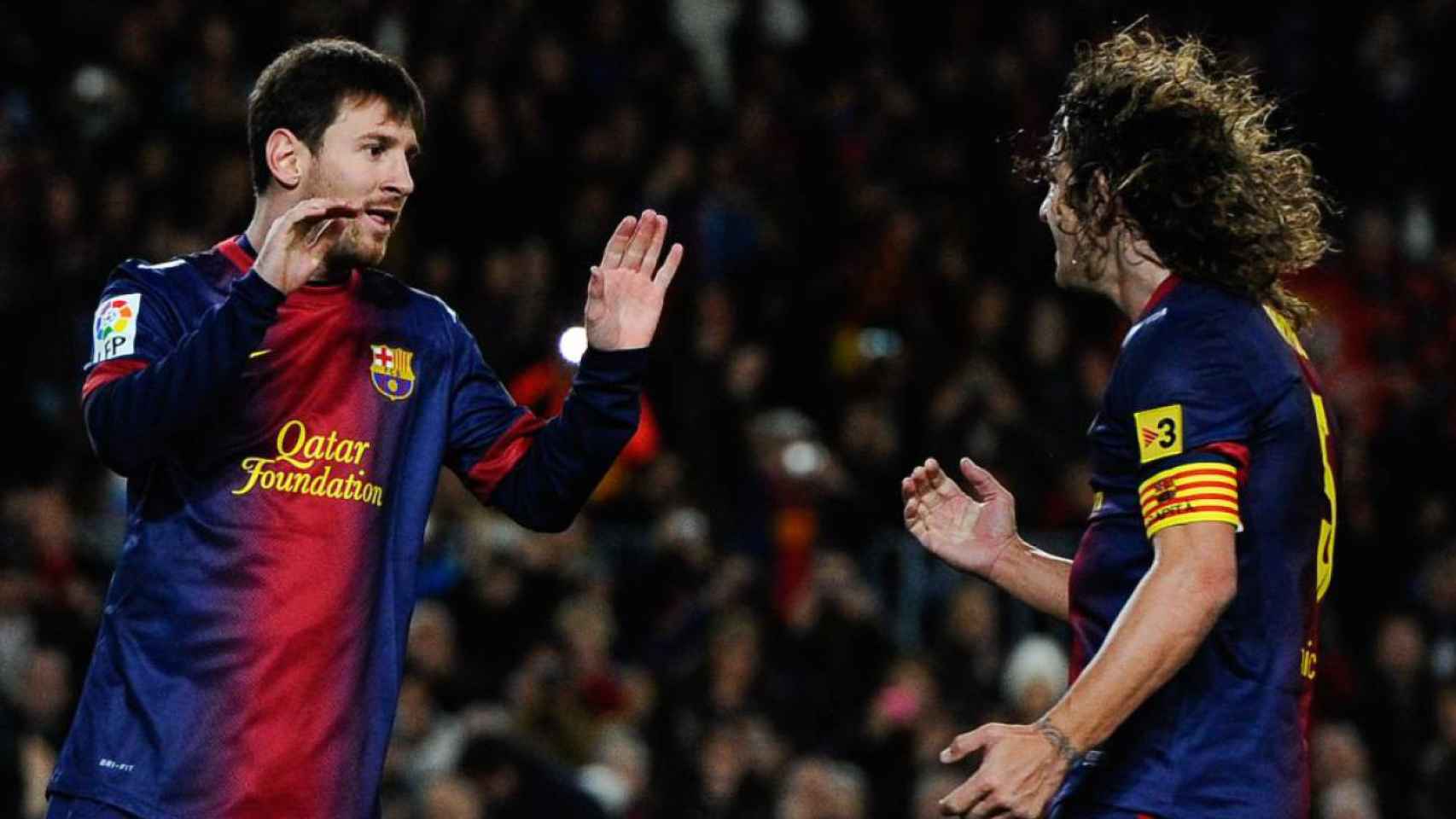 Puyol y Leo Messi celebran un gol con el Barça / EFE