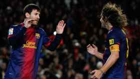 Puyol y Leo Messi celebran un gol con el Barça / EFE