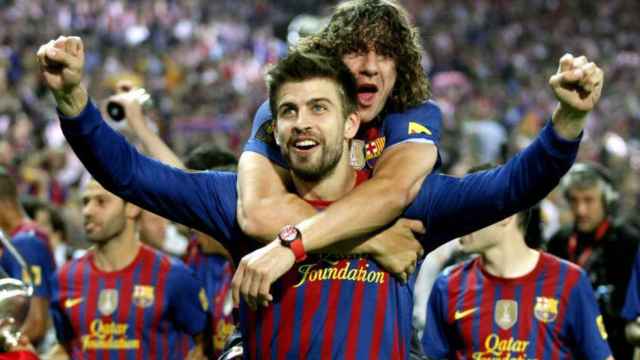 Carles Puyol y Gerard Piqué celebran un título con el Barça / EFE