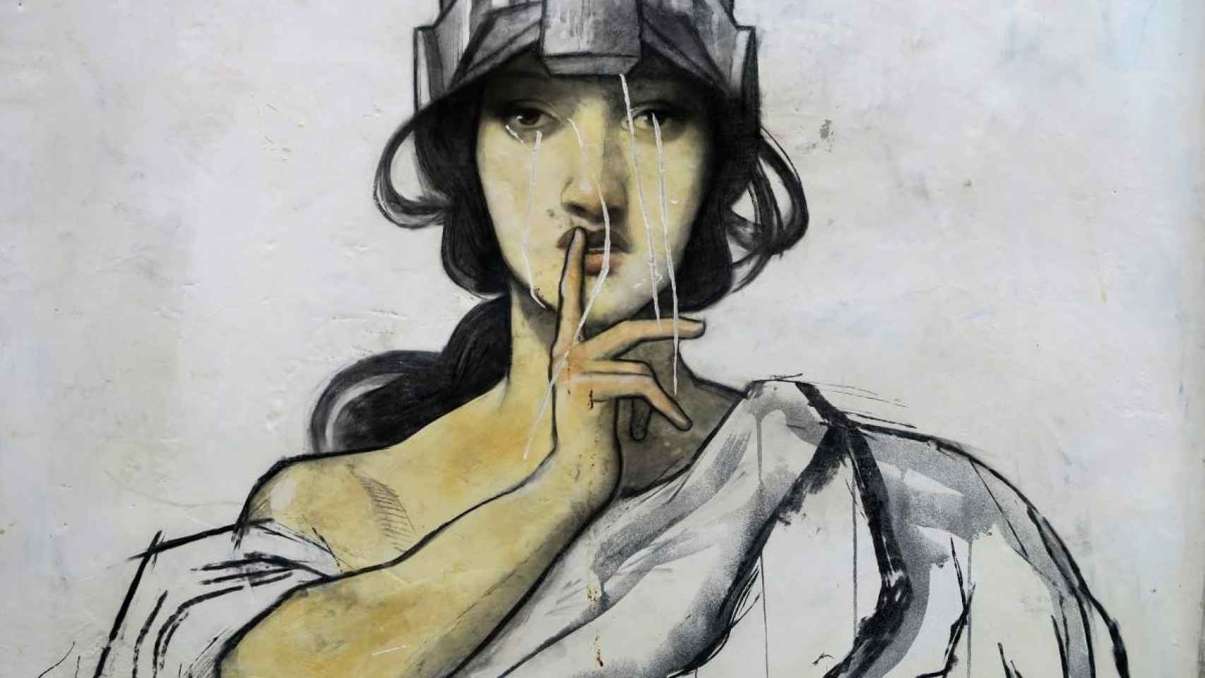 Mural callejero donde la figura de una mujer pide silencio. Ruido