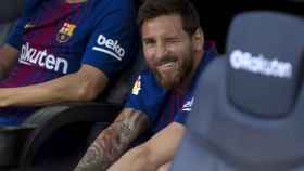 Una foto de archivo de Leo Messi en el banquillo del Barça / FCB