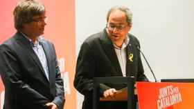 Carles Puigdemont y Quim Torra, durante una rueda de prensa en Bruselas / EFE