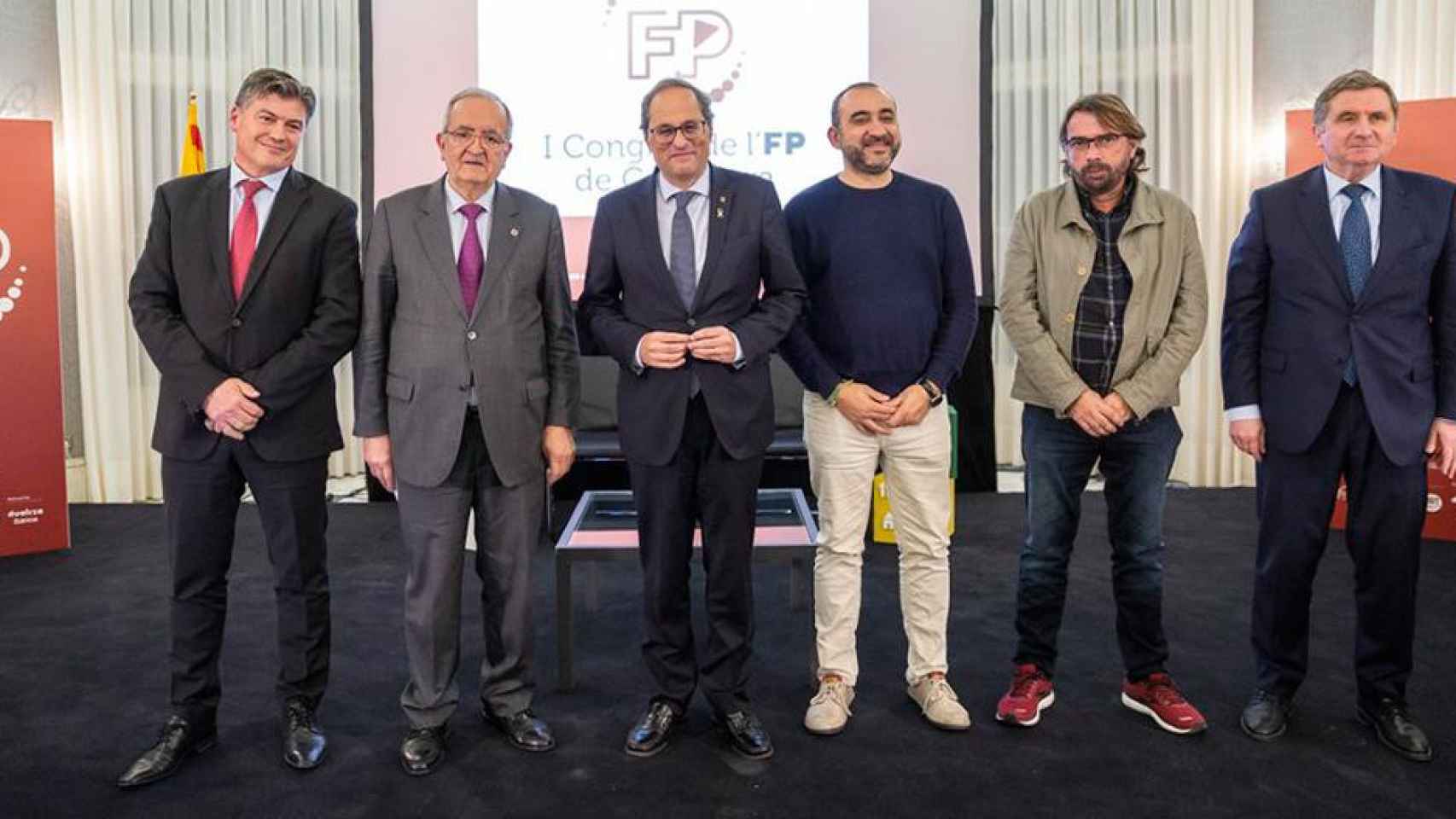 El presidente catalán, Quim Torra (c), en el congreso sobre FP