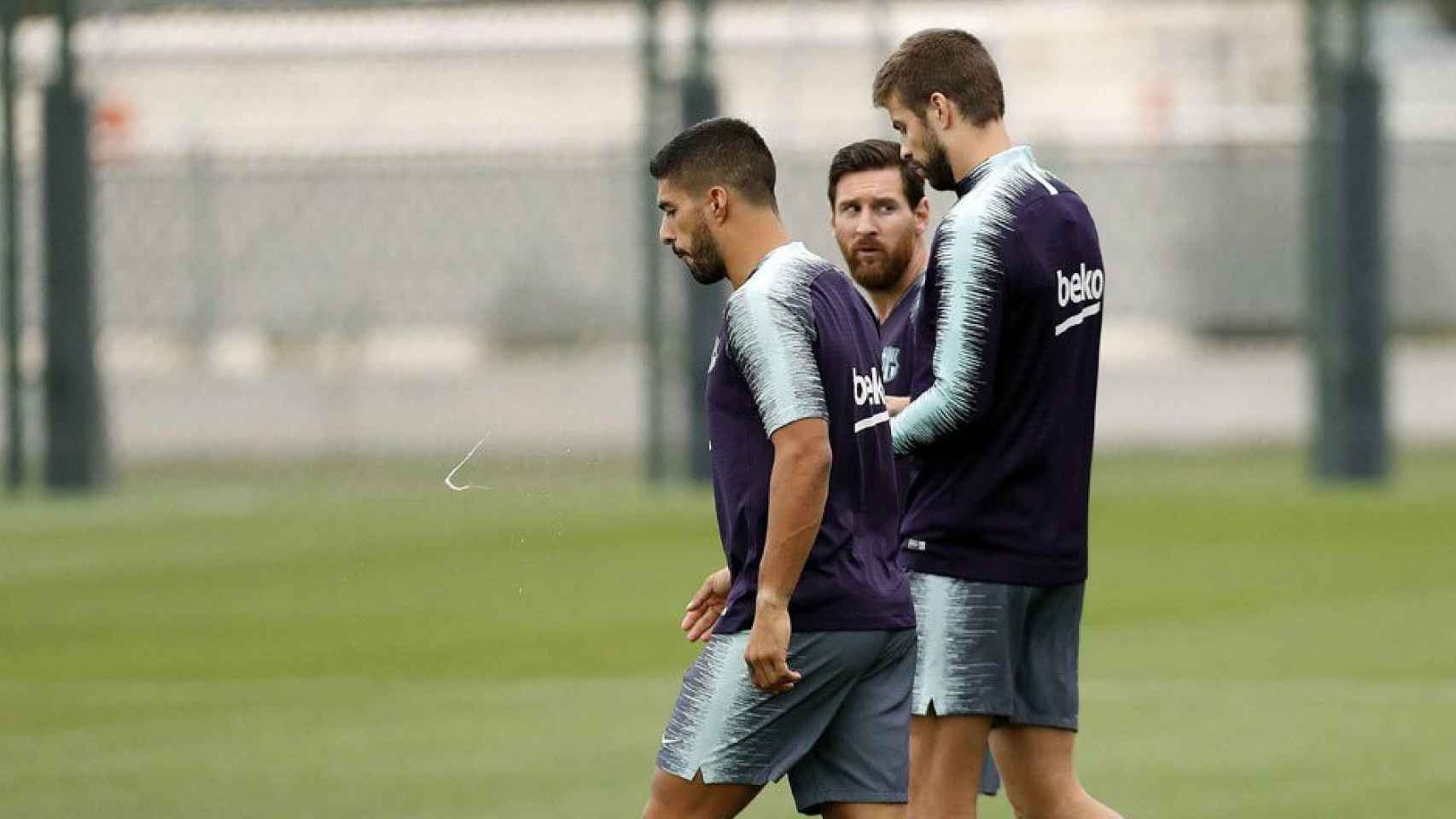 Leo Messi junto a sus confidentes en el Barça, Luis Suárez y Piqué | EFE