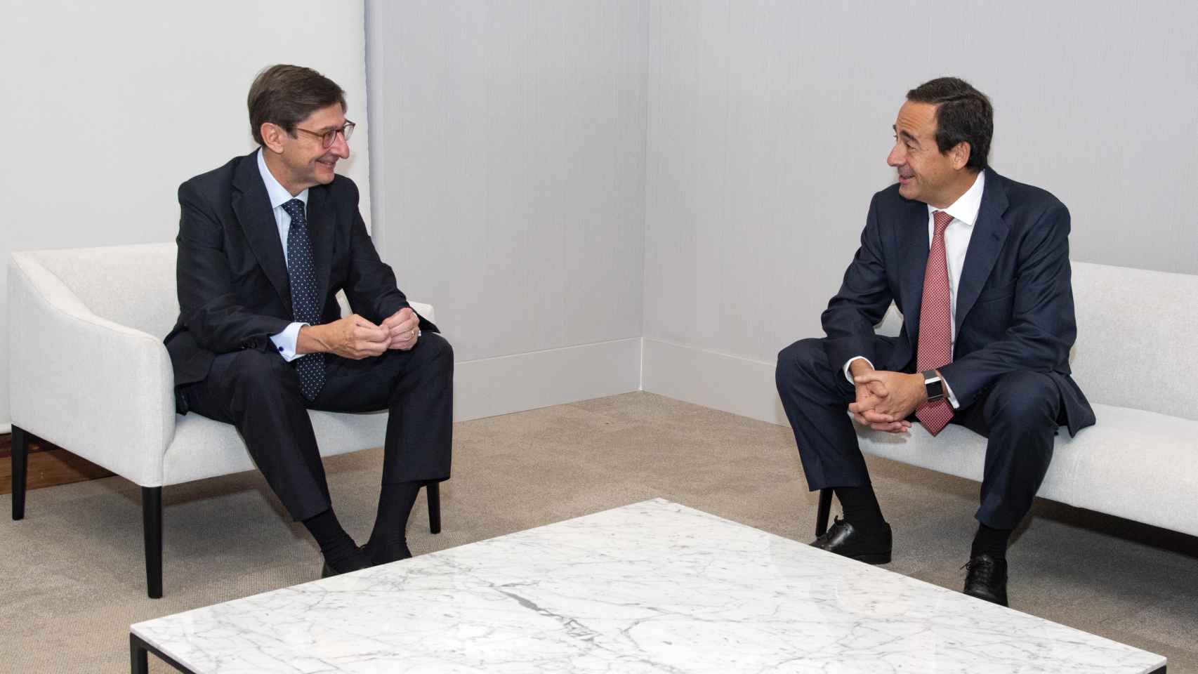 José Ignacio Goirigolzarri (Bankia) y Gonzalo Gortázar (Caixabank) en la presentación del nuevo banco