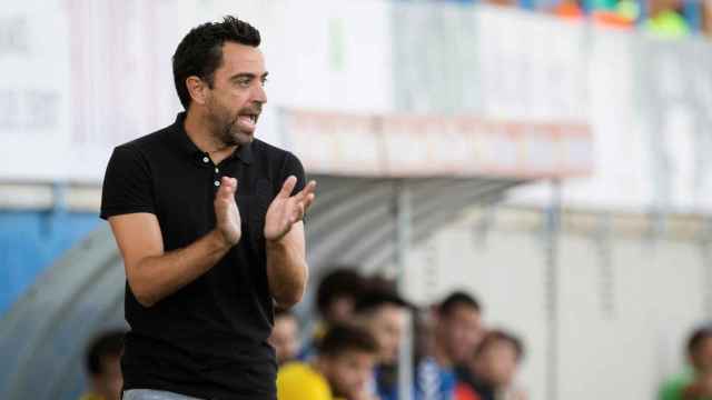 Xavi en el partido entre el Palamós y el Al-Sadd / EFE