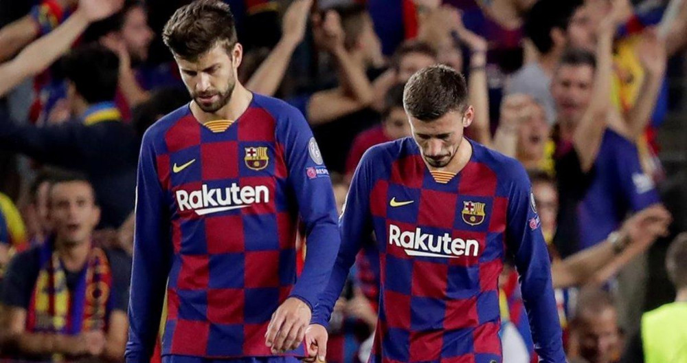Gerard Piqué y Clement Lenget lamentando un gol del Barça / FC Barcelona