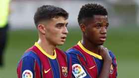 Pedri y Ansu Fati, que podrían negociar con otros equipos en 2022, en un partido con el Barça | EFE
