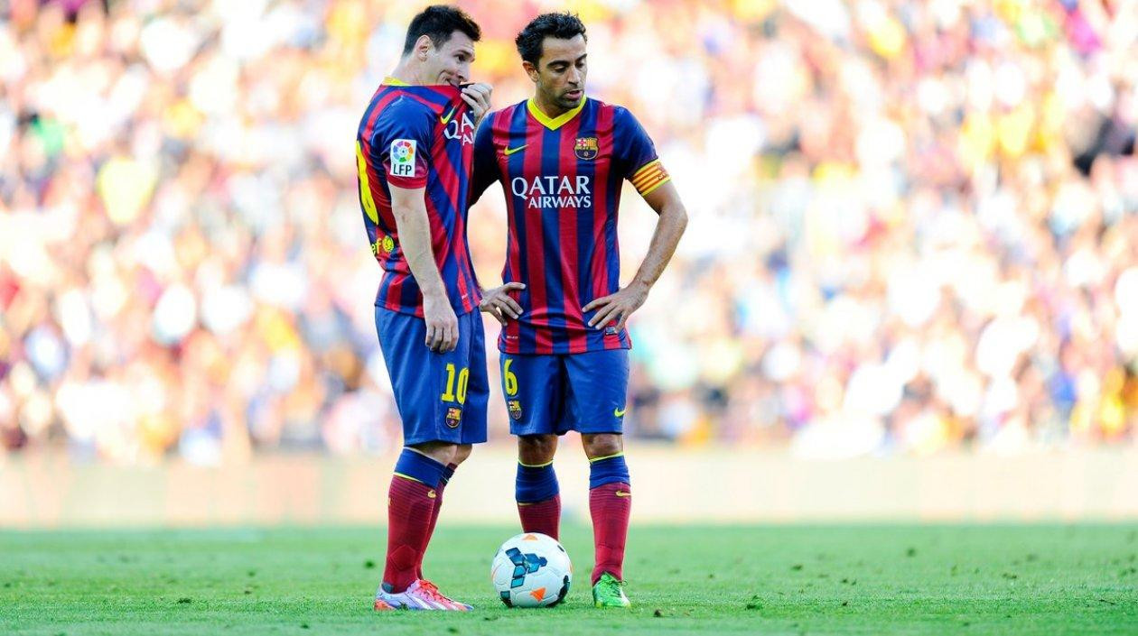 Messi y Xavi en un partido del Barça / EFE