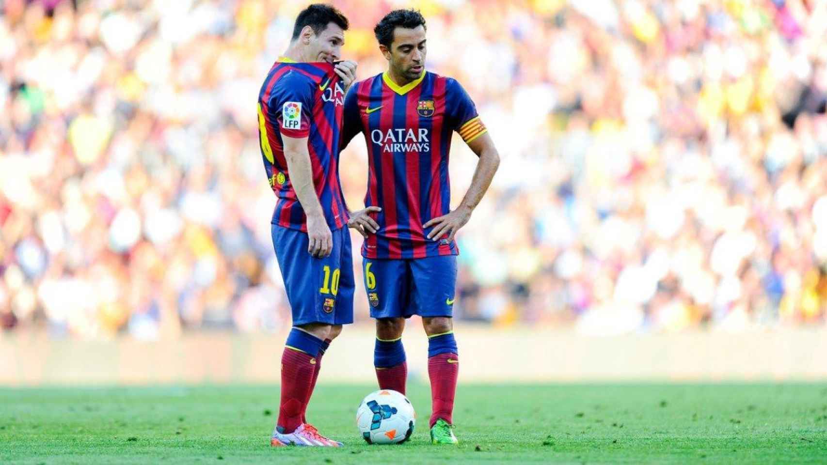 Messi y Xavi en un partido del Barça / EFE