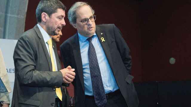 El presidente de la Cámara de Barcelona, Joan Canadell, con el presidente del Govern, Quim Torra / EFE