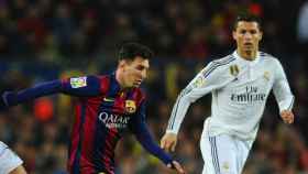 Leo Messi y Cristiano Ronaldo durante un partido / EFE