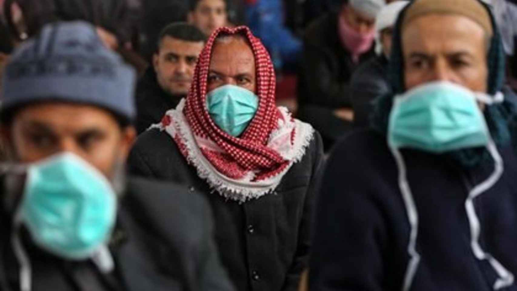 Hombres con mascarilla contra el coronavirus en la Franja de Gaza / EUROPA PRESS