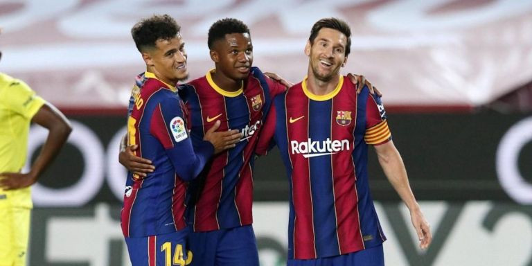Coutinho y Ansu Fati, celebrando un gol con Messi, la temporada pasada / EFE